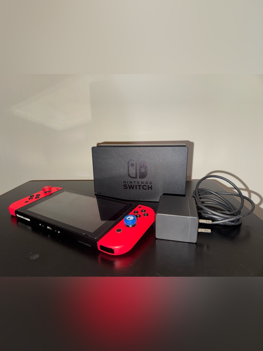 Nintendo Switch with Neon Red Joy-Con and Black Dock